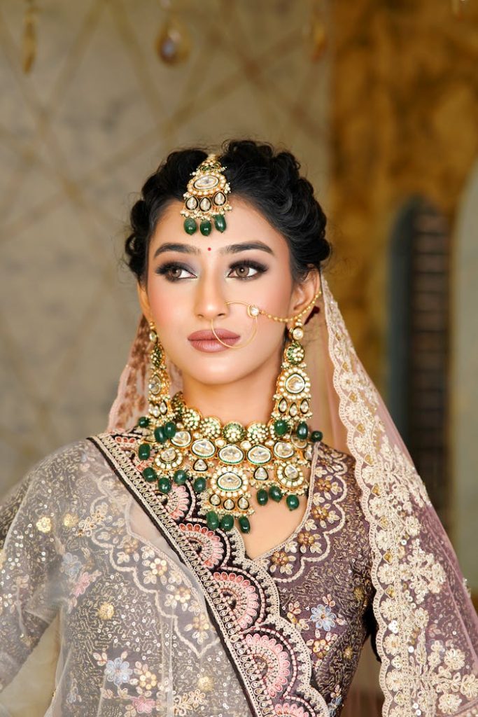 Beautiful Indian bride in ornate traditional attire with intricate jewelry.
