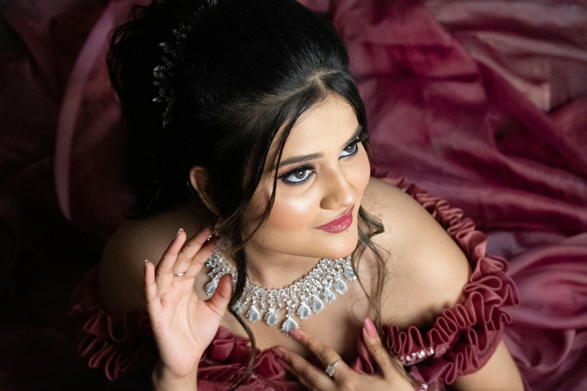 high angle shot of a woman with a necklace
