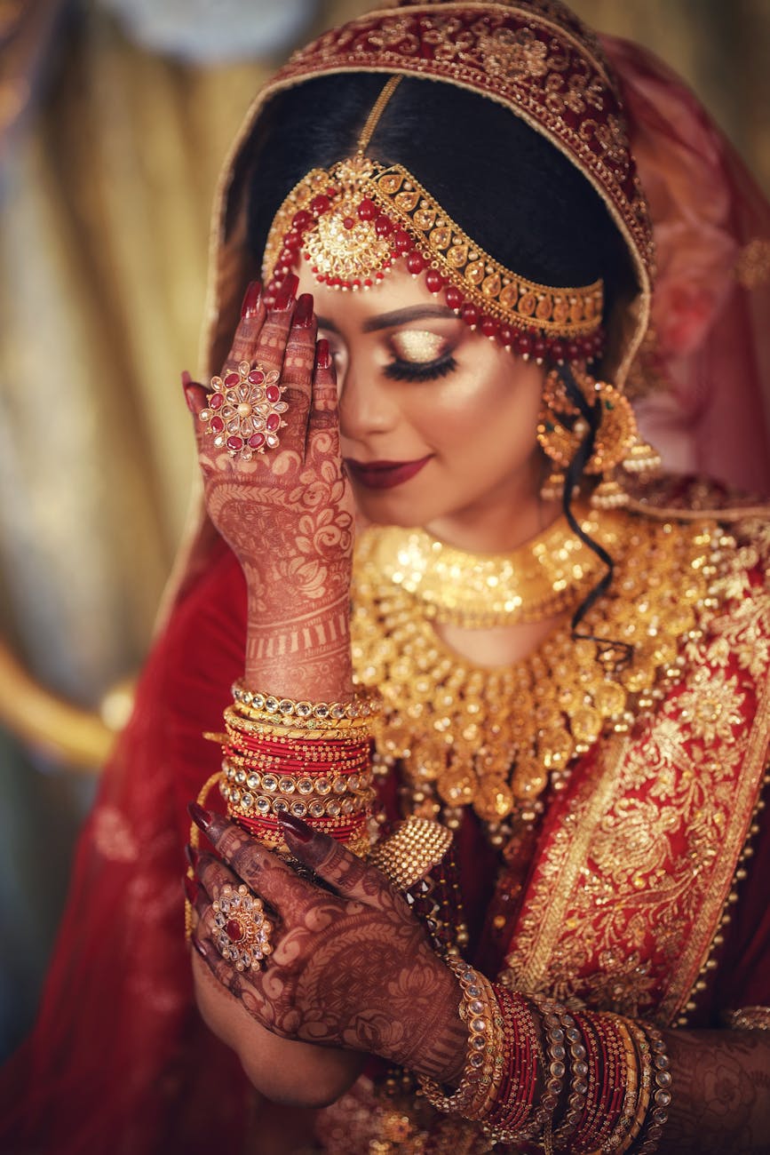 woman in red and gold saree